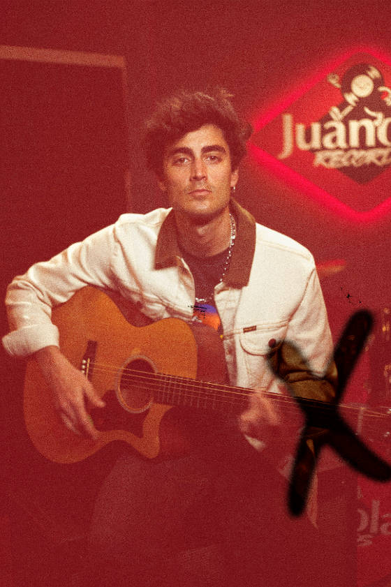 Juanola Records — artist with acoustic guitar in the studio